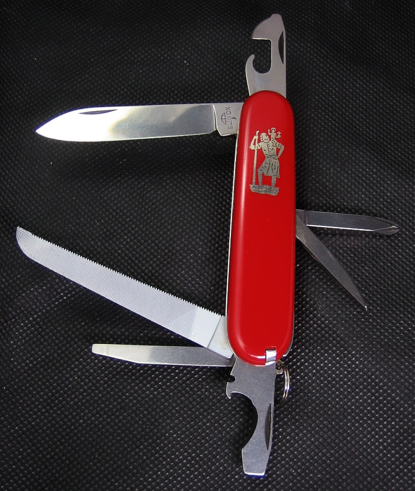 An Elinox Automobile knife, model 8134maU with nickle-silver St. Christopher inlaid in place of the regular Elinox sheild logo.