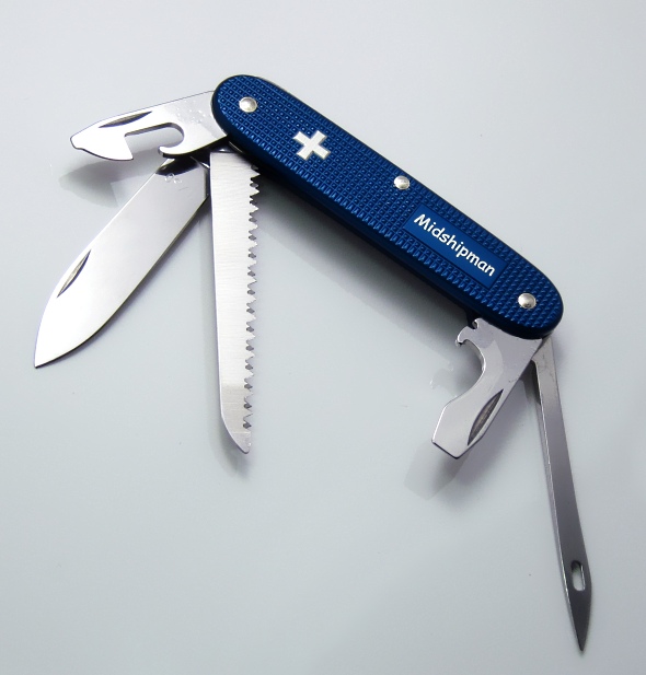 Victorinox Blue Alox Midshipman model from a February 2011 special run of only 50 knives. It features the original Pioneer Range silver Swiss cross on the top scale with "Midshipman" printed in the advertising panel, a series serial number is stamped on the main blade (n/50), and a new, slightly deeper, shade of blue is used for the anodizing.