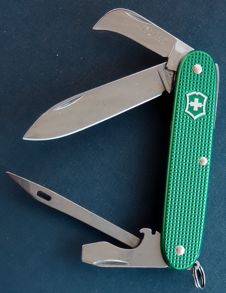 This Victorinox Aqua-Green anodized Alox Pioneer Ranger with Marlinspike/Sacking-Needle instead of the typically Reamer tool was manufactured in 2011 as part of a special limited run of 100 knives. The knives are individually numbered on the small pruner/hawkbill blade. The Aqua-Green color anodizing is very rare, and not known to have existed on a 93mm Alox model prior to this. This model/configuration needs a good name.