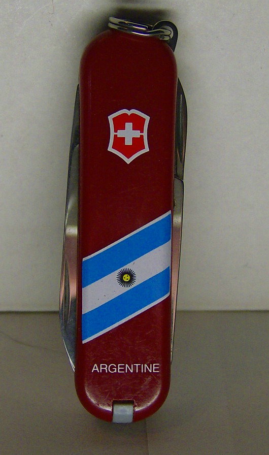 Victorinox National Flag Classic-Argentine----All national flag classics have a flag design diagonally across the front and the nation name straight across the bottom. I am unsure why this one has the country name of Argentine instead of Argentina the more commonly used name.