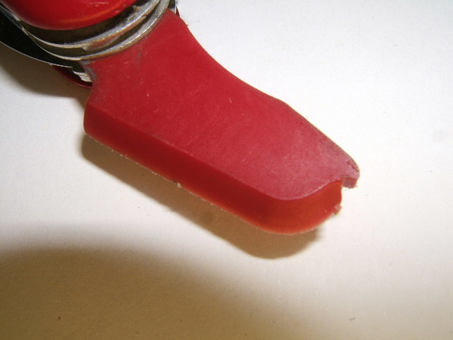 This is a close up shot of the Wenger Ski Scraper tool found on the Skier model Wenger. It is made of plastic and has a nail nick on the tip of the tool. There is a single beveled edge to use for application/removing ski wax on skis.