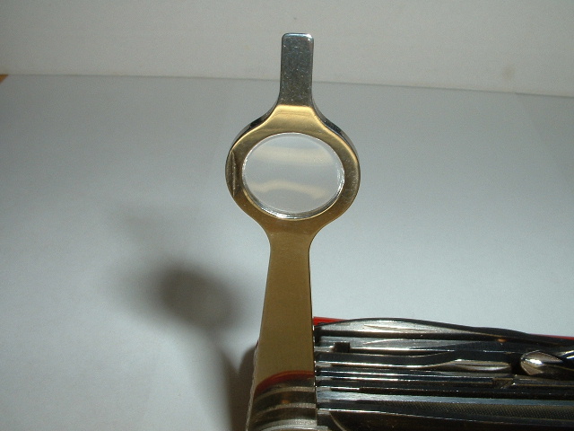This is the Magnifier with screwdriver tip found on Wenger knives.