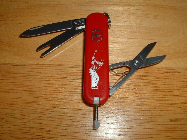 This is a golfing knife with a removable ink pen.