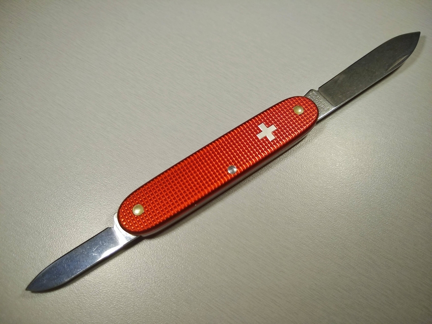 Red alox with the silver Swiss cross 